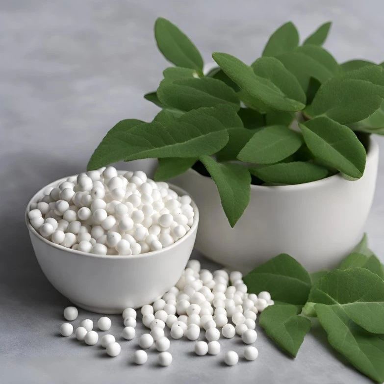 An image of activated alumina beads poured into a container and a pot with green leaves in the background